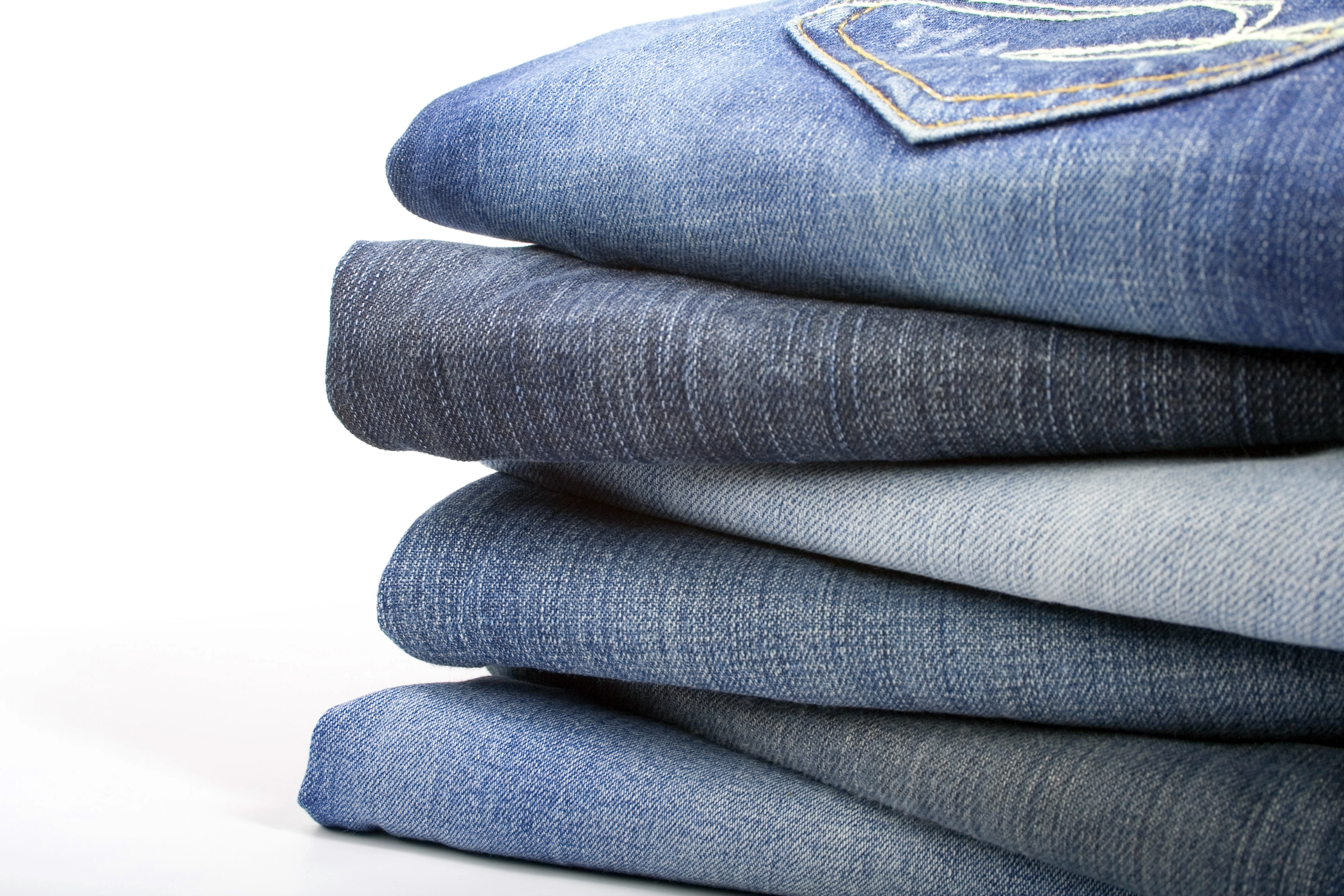 stack of blue jeans