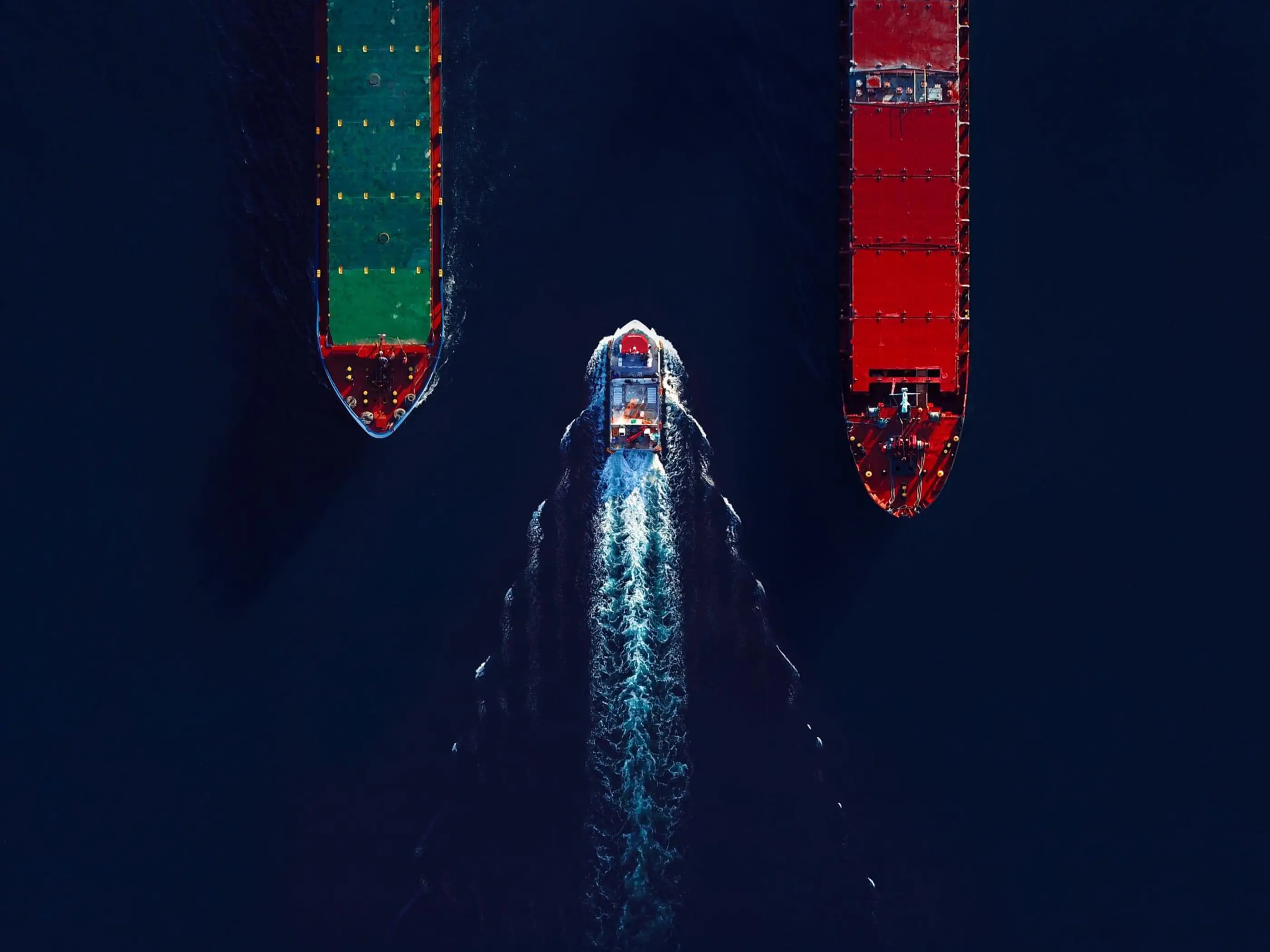 cargo ships in the ocean passing each other 